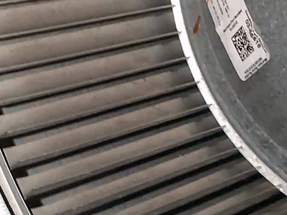 The same blower wheel after cleaning, with clear bare-metal blades