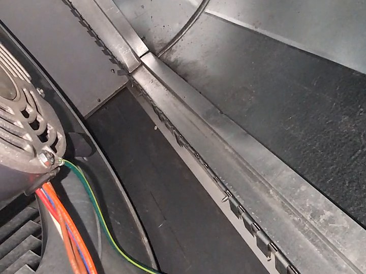 The same shelf after cleaning, wiped back to bare metal